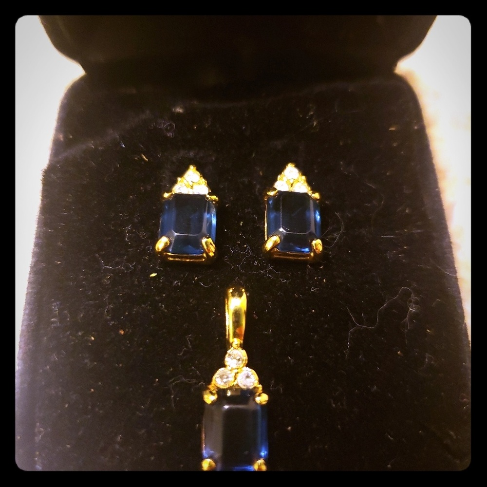 Blue sapphire earrings and matching pendant.